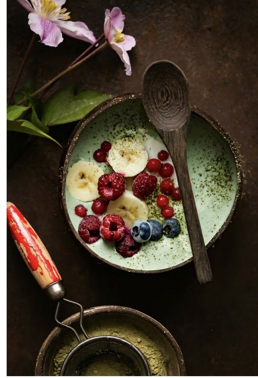 Tigernut matcha oatmeal bowl with banana, raspberries and blueberries